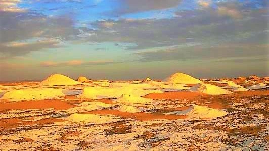 The time before the sunset in the new white desert Farafra Egypt travel booking.webp